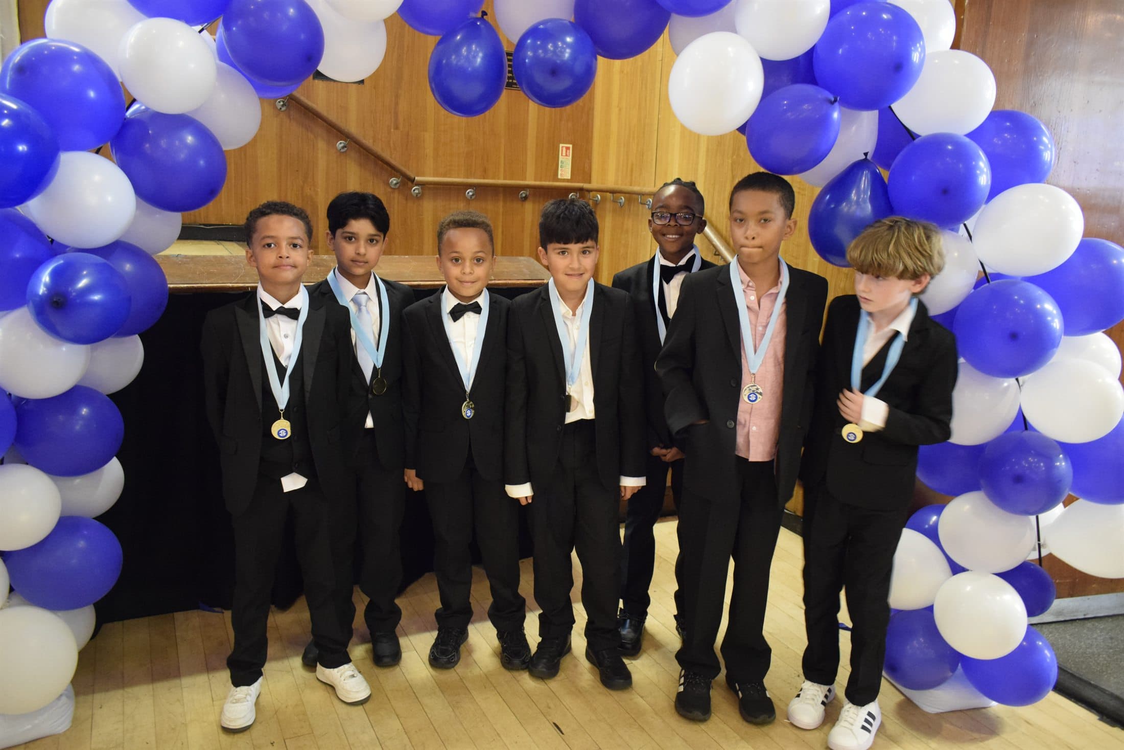 Young people with medals at awards night