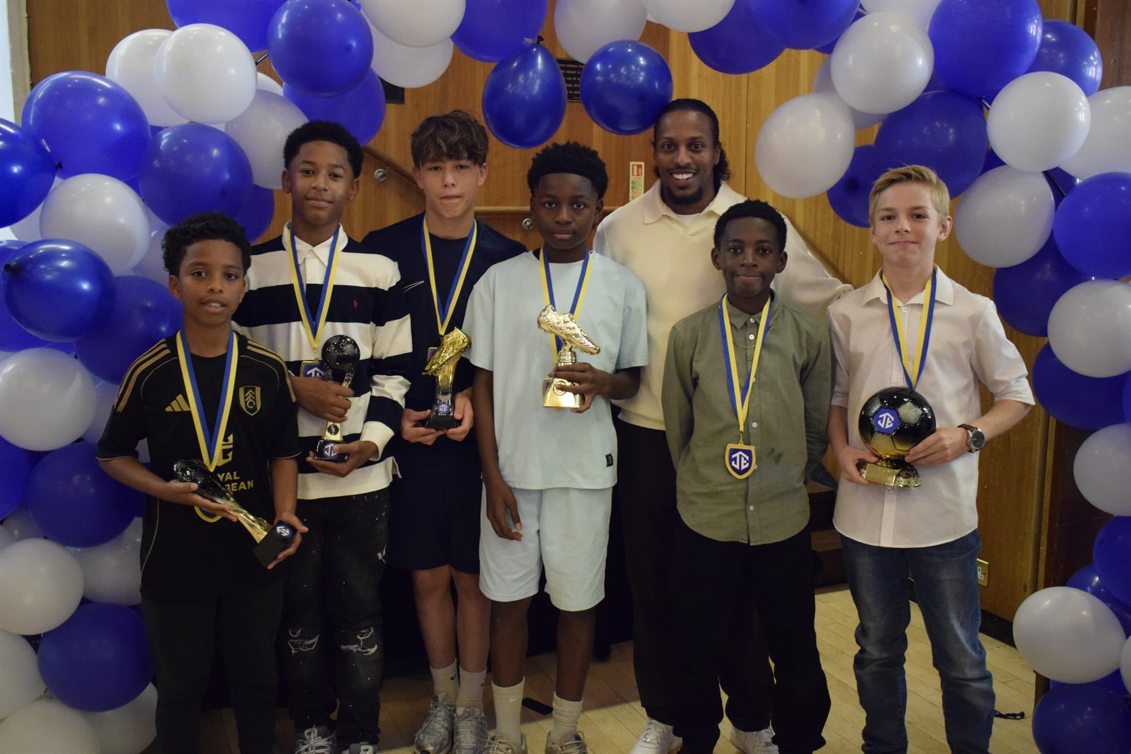 Junction Elite young award winners with trophies and medals
